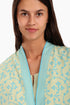Short jacket in printed cotton with one front button and side slits